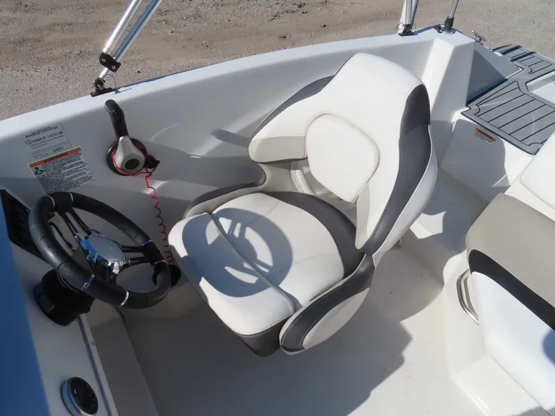 Slide: The Image of 2022 Starcraft SVX 171 boat interior with steering wheel and captain's chair. - 10
