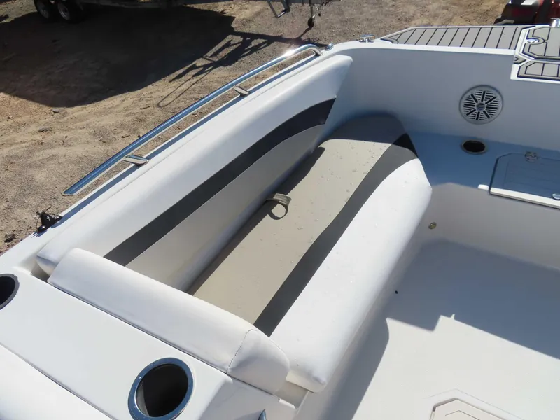 Slide: The Image of 2022 Starcraft SVX 171 boat interior with seating and cup holders. - 15