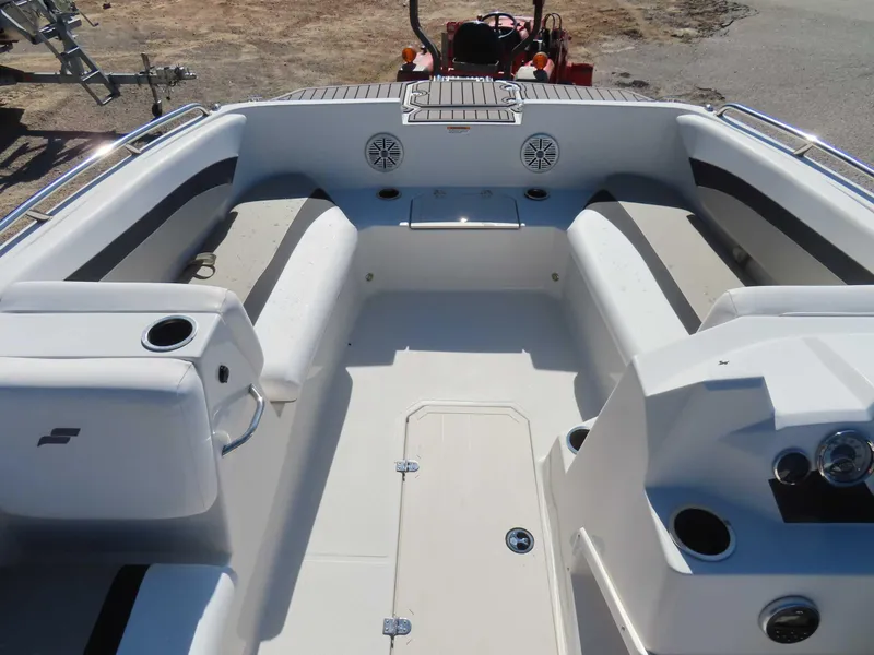 Slide: The Image of 2022 Starcraft SVX 171 boat interior with seating and cup holders. - 17