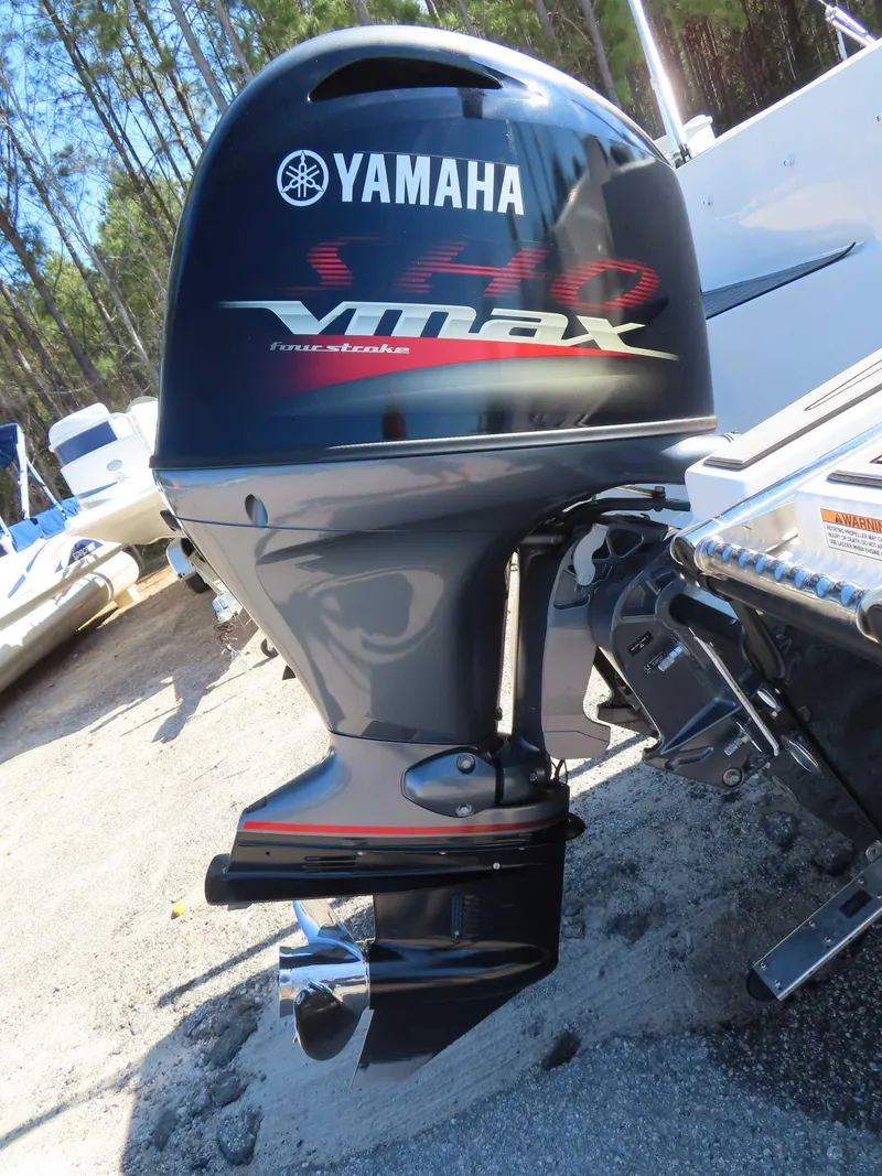 Slide: The Image of Yamaha VMAX outboard motor on 2022 Starcraft SVX 171 boat, parked outdoors. - 21