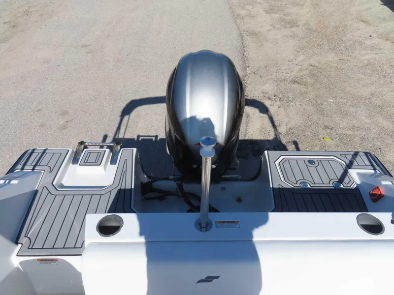 Slide: The Image of 2022 Starcraft SVX 171 boat stern view with outboard motor and deck details. - 29
