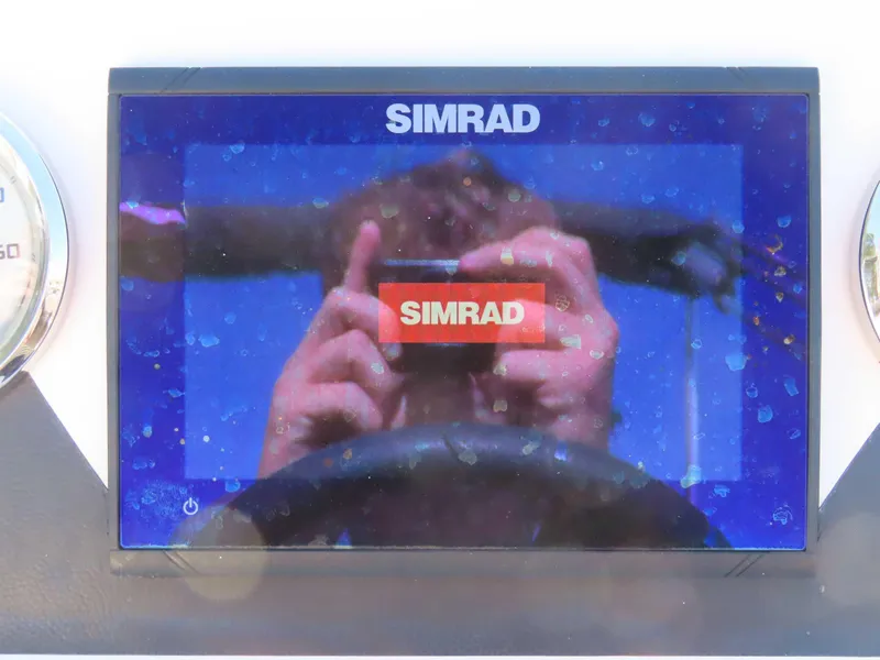 Slide: The Image of Simrad display on 2022 Starcraft SVX 171 boat dashboard, showing reflection. - 3