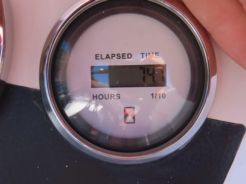 Slide: The Image of Elapsed time gauge showing 74.7 hours on a 2022 Starcraft SVX 171. - 4