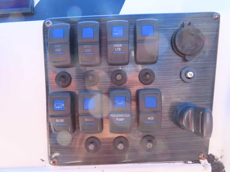 Slide: The Image of Control panel of a 2022 Starcraft SVX 171 boat with labeled switches. - 8