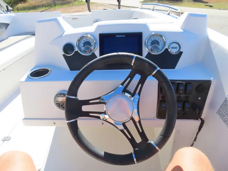 Slide: The Image of Steering wheel and dashboard of 2022 Starcraft SVX 171 boat. - 9