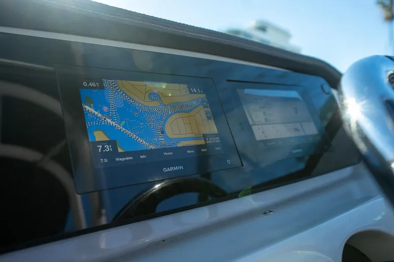 Slide: The Image of 2022 Regal LX2 boat dashboard with Garmin navigation display. - 15