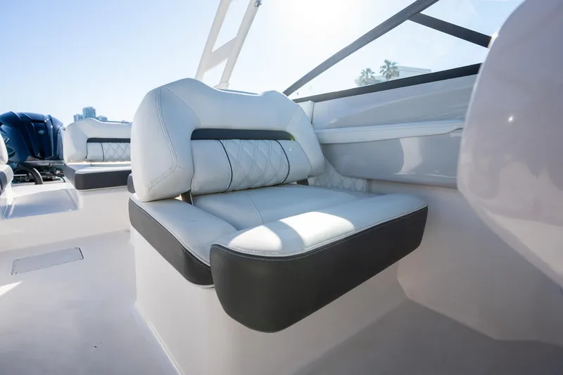 Slide: The Image of Luxurious seating on a 2022 Regal LX2 boat, featuring modern design and comfort. - 18