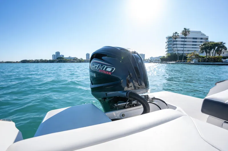 Slide: The Image of 2022 Regal LX2 boat with Yamaha outboard motor on sunny waterfront. - 20