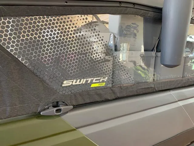 Slide: The Image of 2025 Sea-Doo Switch Fish 18 boat with hexagonal window design and logo detail. - 18