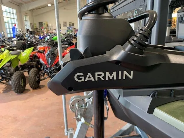 Slide: The Image of Garmin device on 2025 Sea-Doo Switch Fish 18, with ATVs in the background. - 9