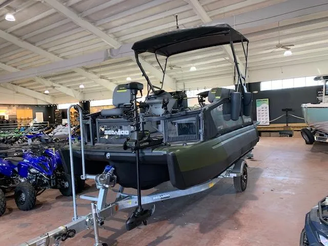 Slide: The Image of 2025 Sea-Doo Switch Fish 18 boat with hexagonal window design and logo detail. - 14