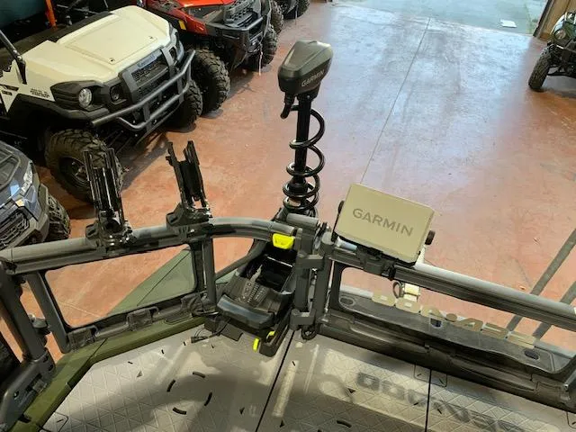 Slide: The Image of 2025 Sea-Doo Switch Fish 18 dashboard with Garmin navigation system in a showroom. - 4