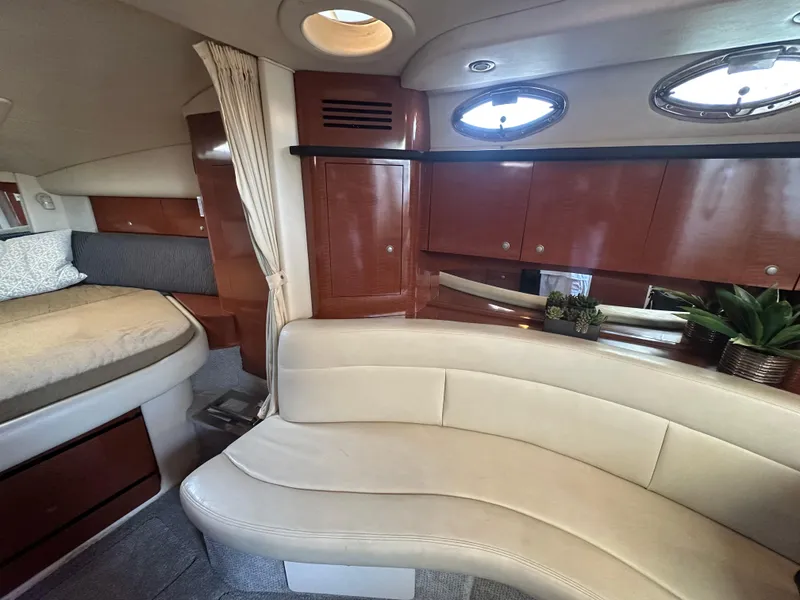 Slide: The Image of Interior of 2005 Sea Ray 320 Sundancer with elegant seating and wood cabinetry. - 22