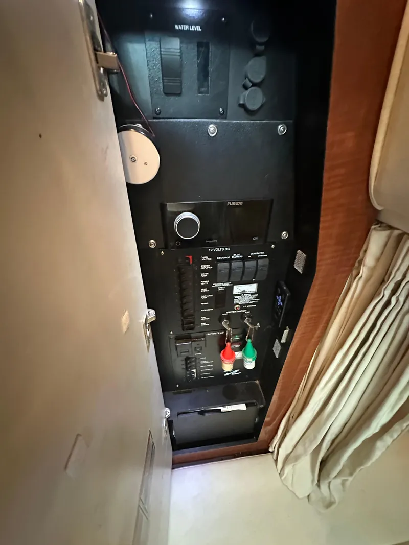 Slide: The Image of Electrical panel inside 2005 Sea Ray 320 Sundancer boat cabin. - 25