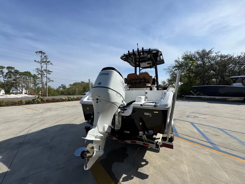 Slide: The Image of 2023 Sea Pro 219 Deep V CC boat with outboard motor on trailer. - 14