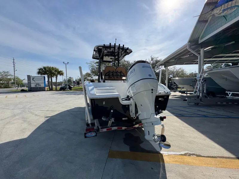 Slide: The Image of 2023 Sea Pro 219 Deep V CC boat on trailer, rear view, sunny day. - 16