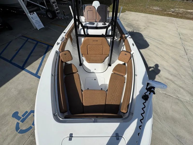 Slide: The Image of 2023 Sea Pro 219 Deep V CC boat with tan seating and spacious deck. - 21
