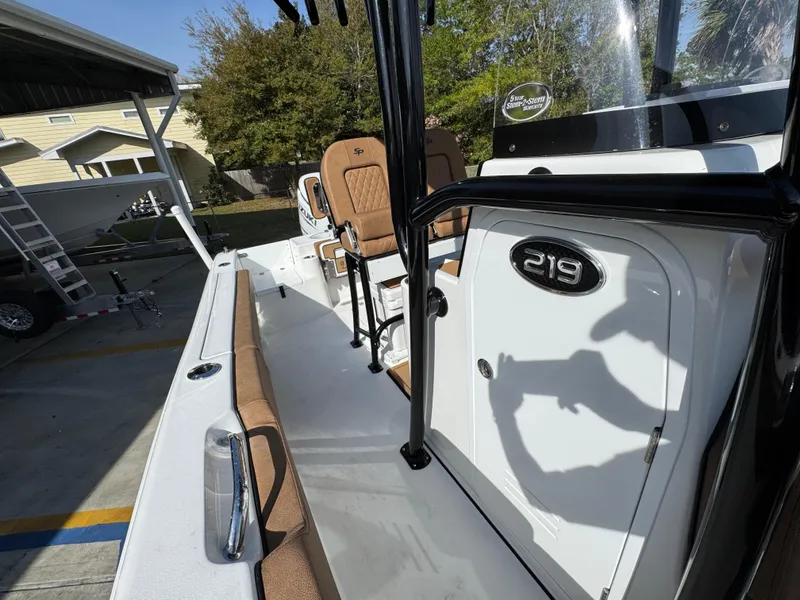 Slide: The Image of 2023 Sea Pro 219 Deep V CC boat, showcasing deck and seating area. - 26