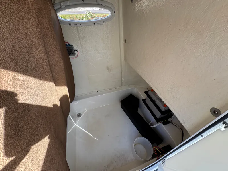 Slide: The Image of Interior cabin of 2023 Sea Pro 219 Deep V CC boat, featuring seating and storage. - 27