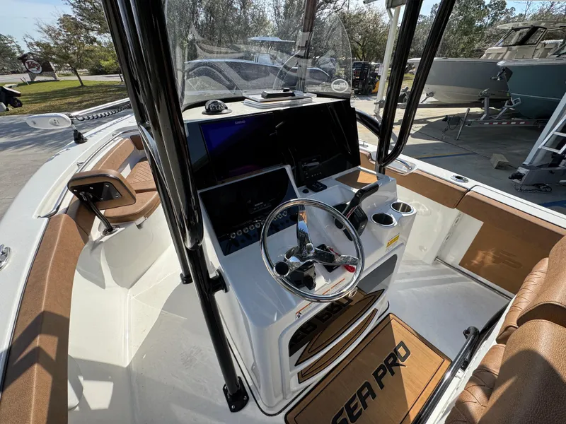 Slide: The Image of 2023 Sea Pro 219 Deep V CC boat console with steering wheel and navigation equipment. - 30