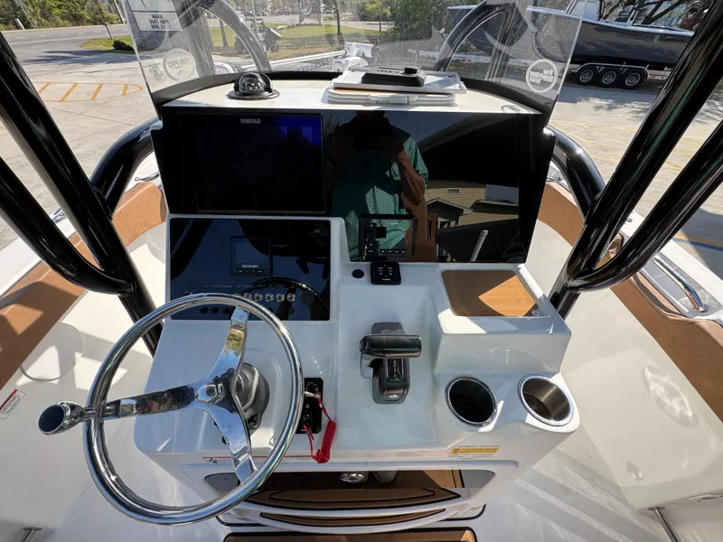Slide: The Image of 2023 Sea Pro 219 Deep V CC boat console with steering wheel and electronic displays. - 31