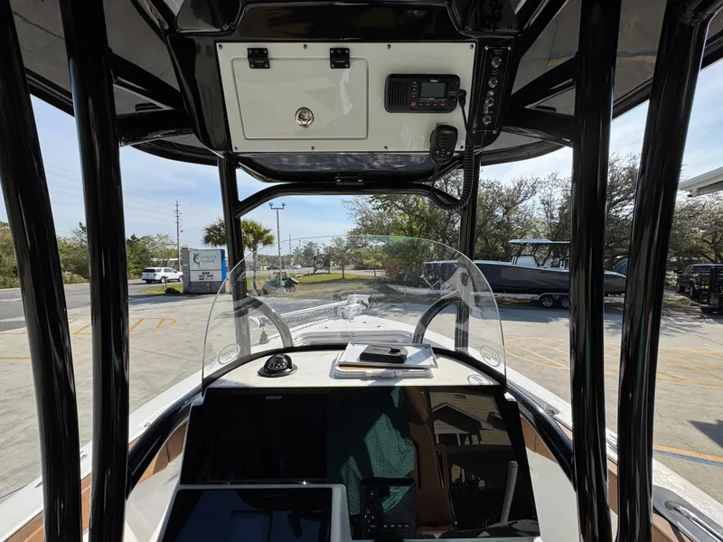 Slide: The Image of 2023 Sea Pro 219 Deep V CC boat interior with console and windshield view. - 32