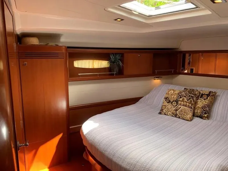 Slide: The Image of Luxurious cabin interior of a 2007 Beneteau 49' Cruiser with elegant wood finish. - 12