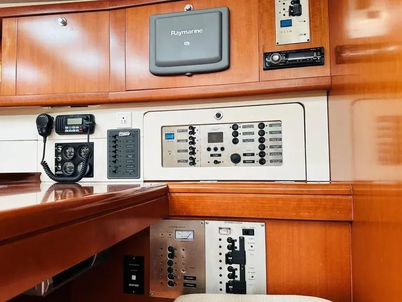Slide: The Image of Control panel of a 2007 Beneteau 49' Cruiser with navigation and communication equipment. - 22