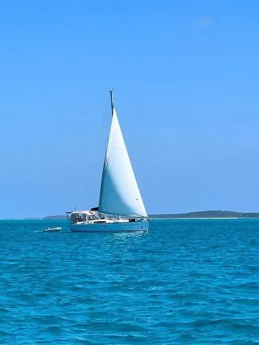 Slide: The Image of 2007 Beneteau 49' Cruiser sailing on clear blue ocean under sunny skies. - 27