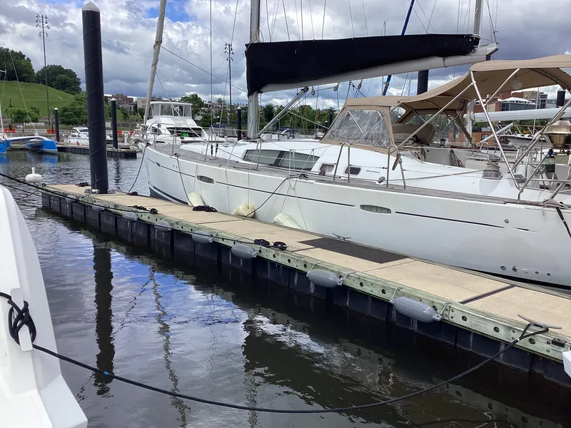 Slide: The Image of 2007 Beneteau 49' Cruiser yacht docked at marina, calm water reflections. - 33