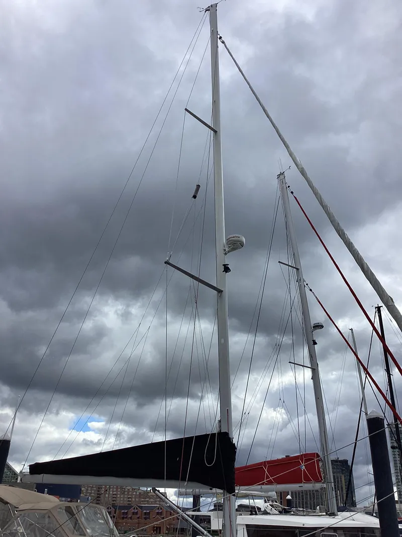 Slide: The Image of Sailboat mast of a 2007 Beneteau 49' Cruiser under cloudy skies. - 37