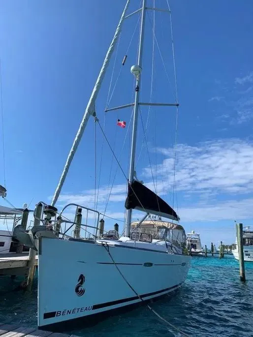 Slide: The Image of 2007 Beneteau 49' Cruiser docked in clear blue waters under a sunny sky. - 5