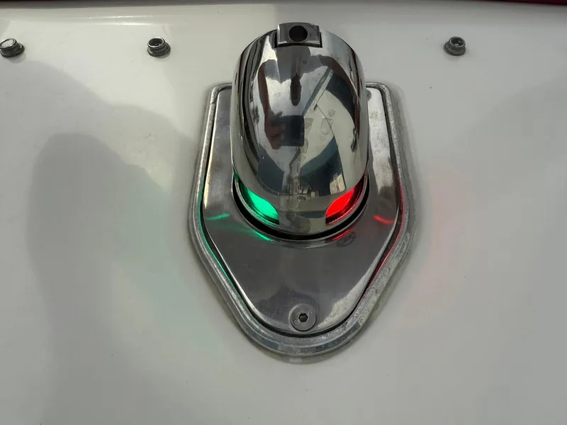 Slide: The Image of Navigation light on 2003 Lavey Craft 2750 NUERA boat, featuring red and green indicators. - 10
