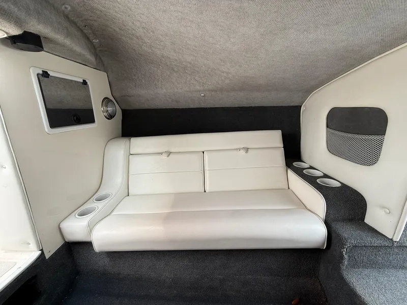 Slide: The Image of Interior of 2003 Lavey Craft 2750 NUERA boat with white seating and cup holders. - 16