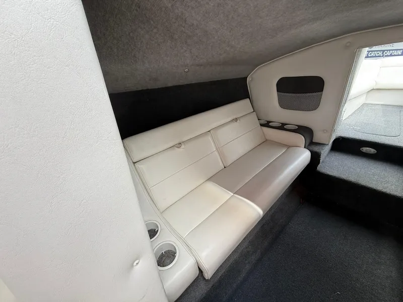 Slide: The Image of Interior of 2003 Lavey Craft 2750 NUERA boat with cushioned seating and cup holders. - 18