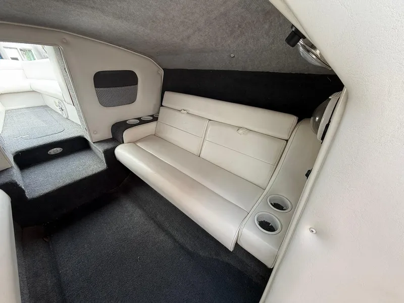 Slide: The Image of Interior of 2003 Lavey Craft 2750 NUERA boat with white seating and cup holders. - 19