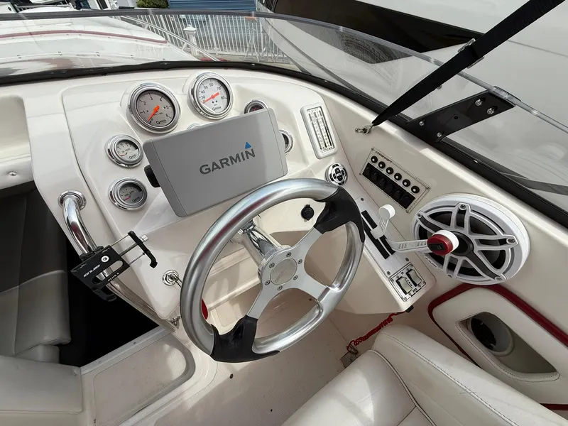 Slide: The Image of 2003 Lavey Craft 2750 NUERA boat dashboard with Garmin GPS and modern controls. - 21