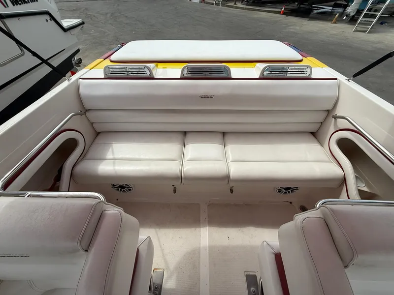 Slide: The Image of 2003 Lavey Craft 2750 NUERA boat interior with white seating and speakers. - 24