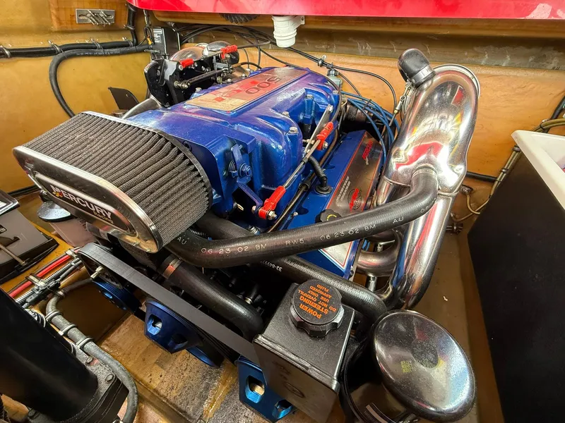 Slide: The Image of 2003 Lavey Craft 2750 NUERA engine with blue components and chrome exhaust. - 29