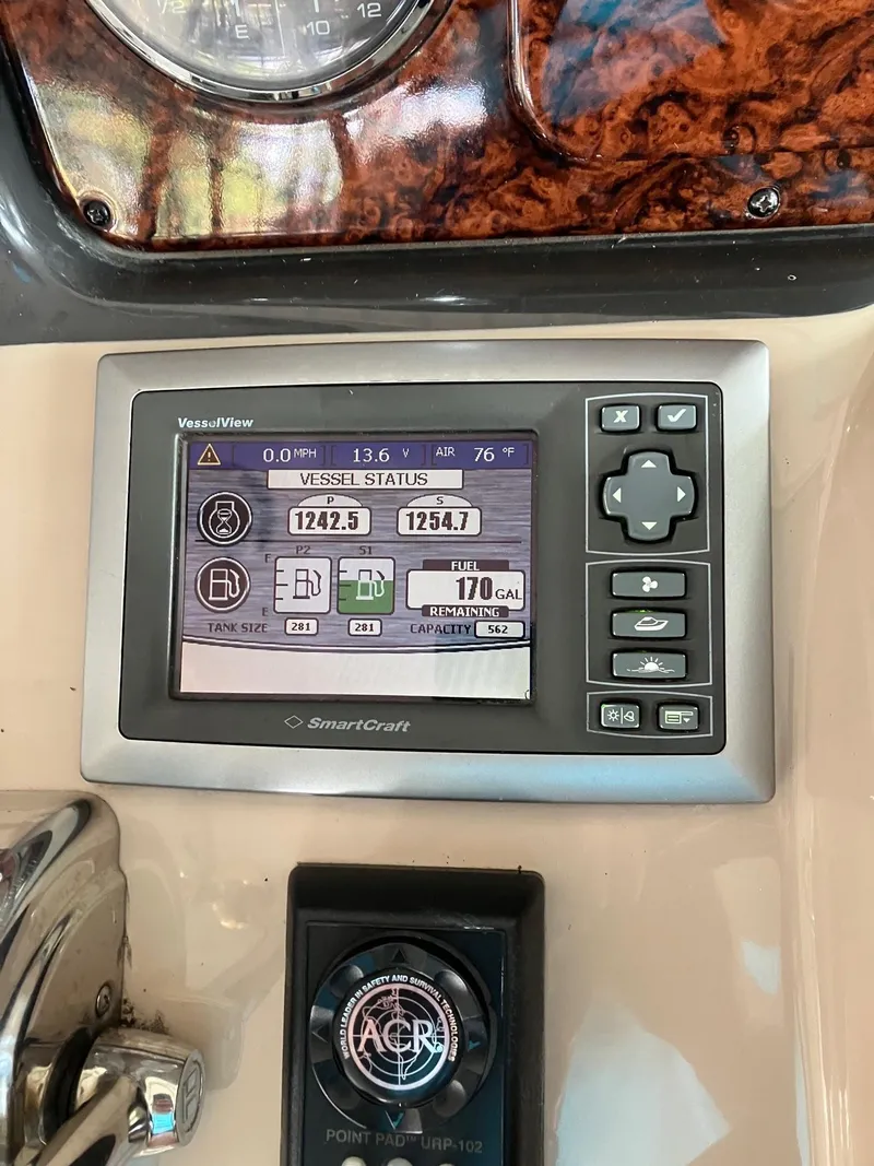 Slide: The Image of Control panel of a 2005 Sea Ray 500 Sundancer boat, displaying vessel status. - 18