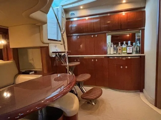 Slide: The Image of Luxurious interior of 2005 Sea Ray 500 Sundancer yacht with elegant wood finishes. - 29