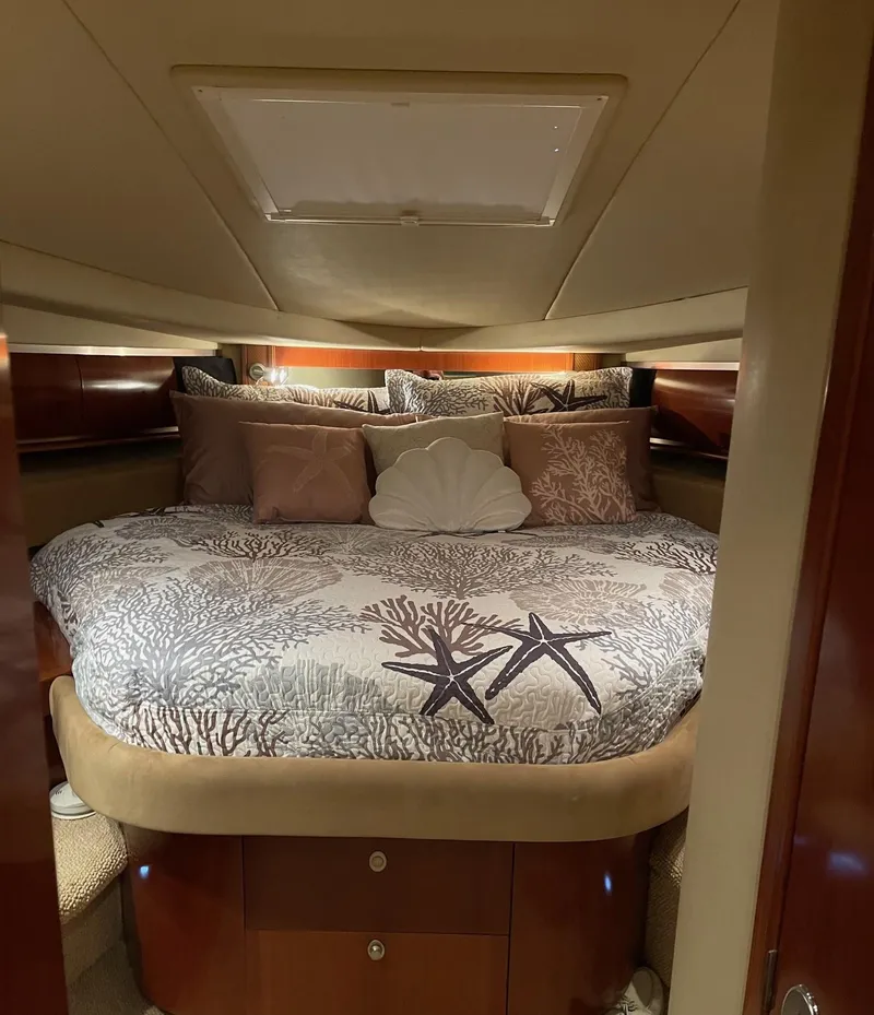 Slide: The Image of Luxurious cabin interior of 2005 Sea Ray 500 Sundancer yacht with elegant bedding. - 8