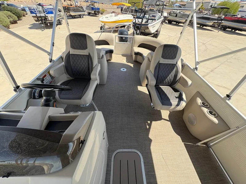 Slide: The Image of 2019 Bennington 23 SXP pontoon boat interior with plush seating and modern design. - 11