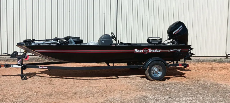 Slide: The Image of 2025 Tracker Bass Tracker Classic XL boat on trailer, parked outdoors. - 10
