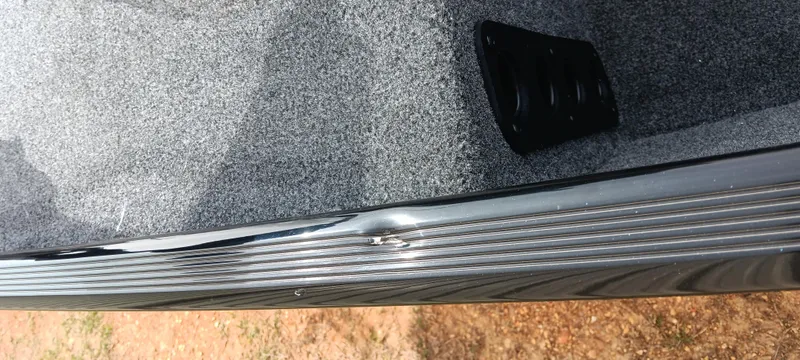 Slide: The Image of 2025 Tracker Bass Tracker Classic XL with minor hull damage, close-up view. - 20