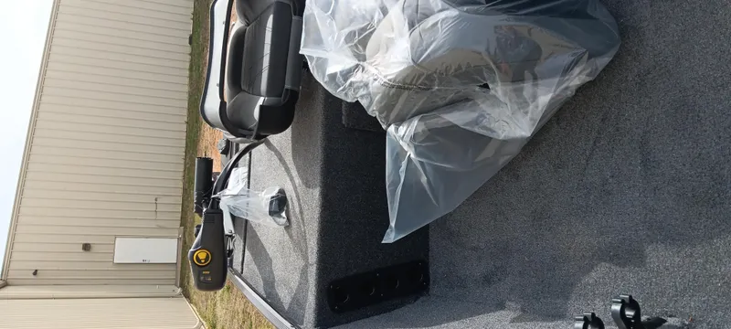 Slide: The Image of 2025 Tracker Bass Tracker Classic XL boat interior with seats and equipment. - 21