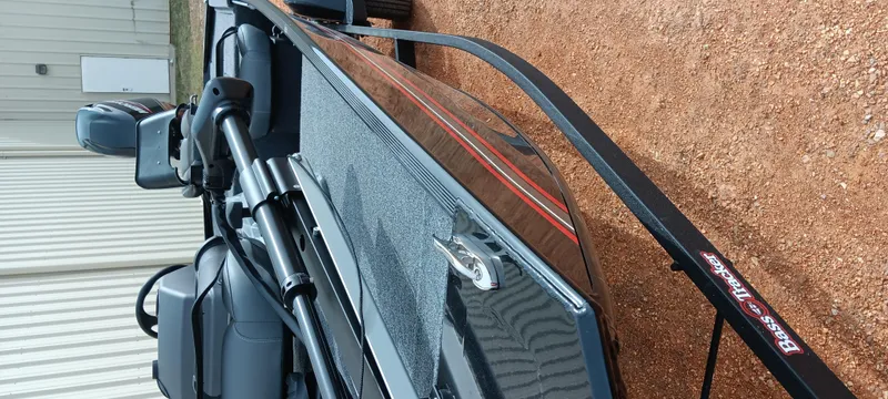 Slide: The Image of 2025 Tracker Bass Tracker Classic XL boat on a trailer, side view. - 26