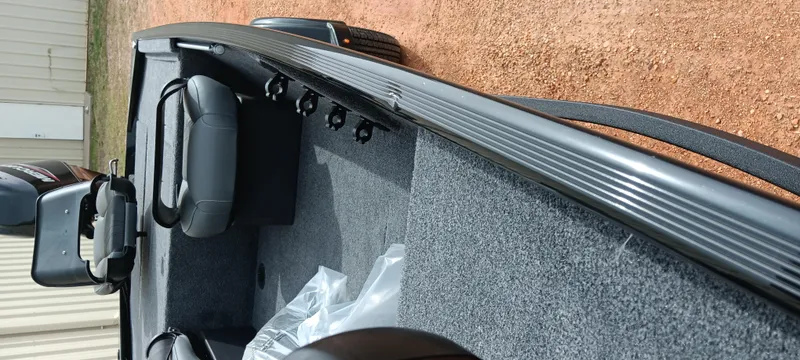 Slide: The Image of 2025 Tracker Bass Tracker Classic XL boat interior with seating and carpeted flooring. - 27