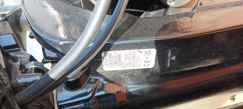 Slide: The Image of 2025 Tracker Bass Tracker Classic XL engine detail with label and wiring. - 32