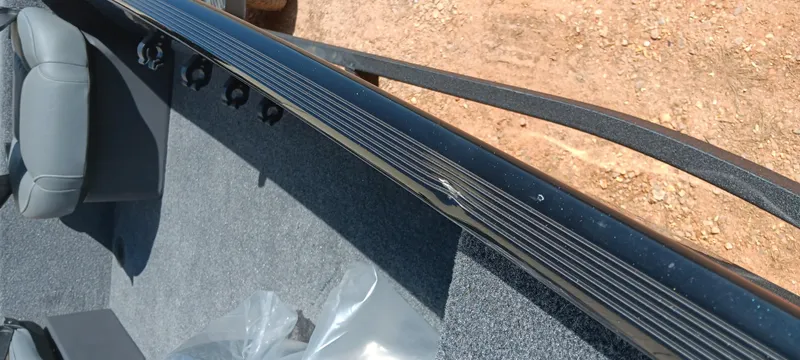 Slide: The Image of 2025 Tracker Bass Tracker Classic XL interior with gray seating and textured flooring. - 9